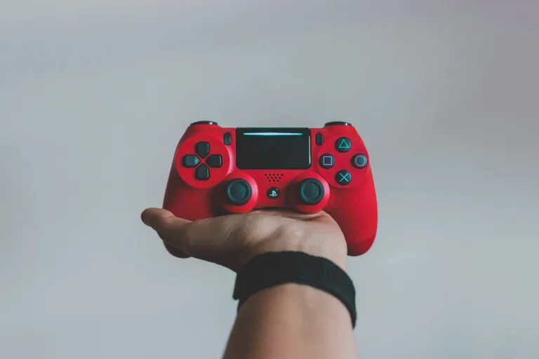 Teenager putting down a device at a parent's request, managing screen time boundaries