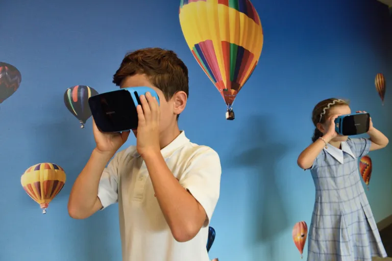 Child using a device online, highlighting the need for parental controls and internet safety