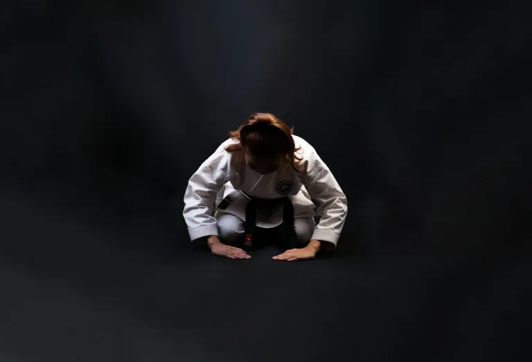 Person experiencing shame, illustrating the physical and emotional weight of the emotion